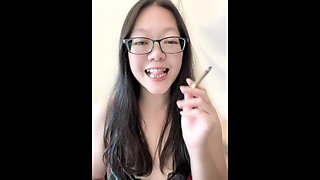 Real Smoking Asian Girl POV: Coming Home to Hot Asian Flashing Her Perky MILF Boobs While Smoking Little Cigars