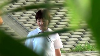 Asian students urinating outdoors