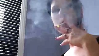 Brunette babe smoking while interrogating