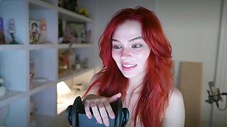 Redheaded pierced teen close up toy show