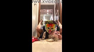 MILF Lila Lovely's Rendezvous with Clown Gibby in Public Restroom