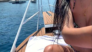 HOT BRUNETTE IN A BIKINI GETS AN ORGASM ON YACHT WHITH