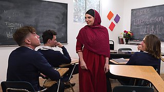 The hijab-wearing milf Kiki Daire teaches her student with a thong in the classroom.
