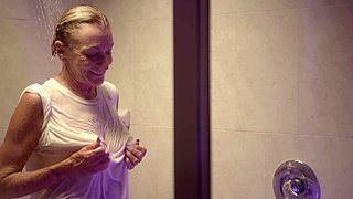 Granny Sydni Lane, 73 years young, showers in a white t-shirt