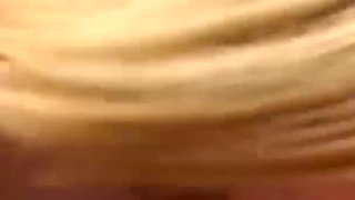 Blonde milf rides on the beach