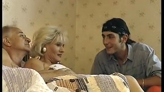 Hairy blonde mature gets spitroasted in a threesome