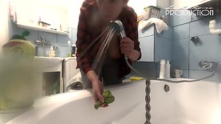 Lena's massive breasts on display while cleaning the bathtub