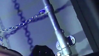 Lady Valeska and Miss Patricia have their sub over a bench.