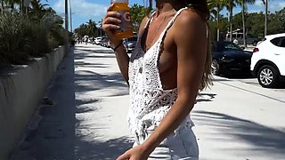 Blonde is flashing her big boobs in the outdoors