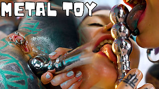 Oiled up Lesbians Share a Metal Toy