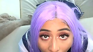 A youthfull adult girl with purple hair wears a sailor