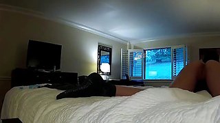 A diminutive dark-haired is jerking on a bed
