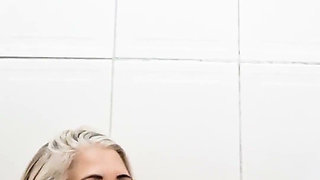 In the Bathroom, Sticking Dildo in Her Pussy
