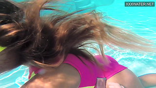 Cute teen Irina Poplavok swims naked underwater