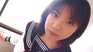 Young Japanese schoolgirl gives her first blowjob