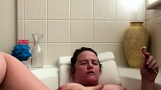 Attractive brunette teenager with big boobs fingering pussy