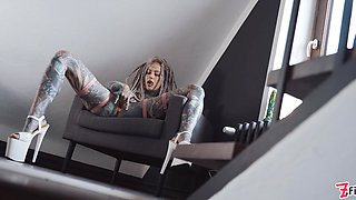Gorgeous tattooed girl fucks her ass with a big dildo