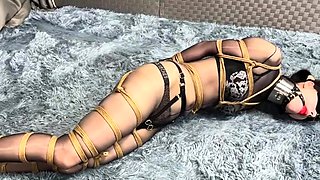 Long legs encased in glossy black stockings Bondage