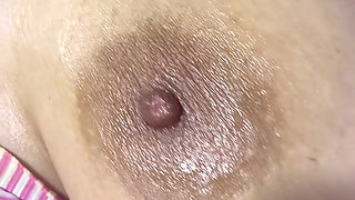 Mom oils herself very delicious and massages her tits