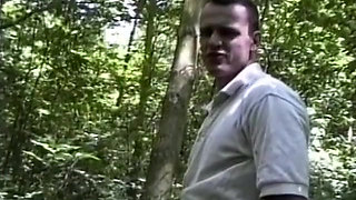 Busty brunette teen blowing big dick in the forest