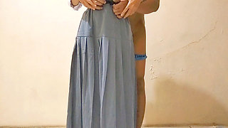 A high school girl who is still wearing a hooded uniform sighs together