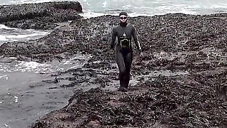 Rubbery Beach Encounter: Lucy's Neoprene Pussy Play with Stranger