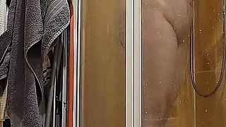 A Busty BBW Showering in the Shower Cabin, Shaving Her Armpits, Pussy, and Legs.