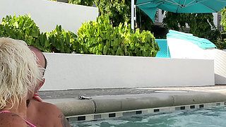 Getting frisky in the hot tub. Boob play.