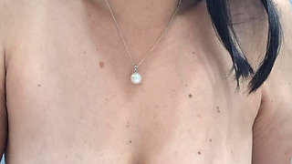 Milf playa with pasta in her mouth, showing hoff her mature breasts