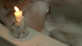 A Slender Beauty Takes a Bath with Foam Caressing Pussy. Annahomemix