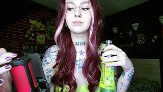Sexy Alternative Redhead Drinking Soda and Burping