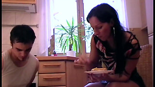 Lady makes her pet eat off the flor