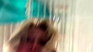 Gymnast in the bath with a dildo