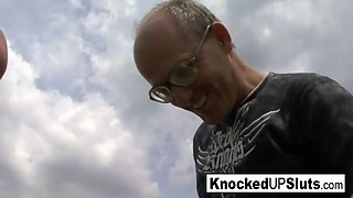 Knocked up slut takes care of a cock outdoors