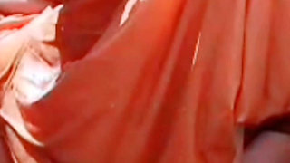 While bathing, the village woman is taking a bath naked after taking off her clothes completely