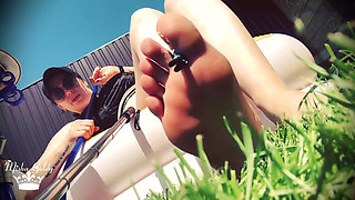 Little weak man destroyed by giantess feet outdoors