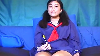 Asian petit on the cock in a college uniform